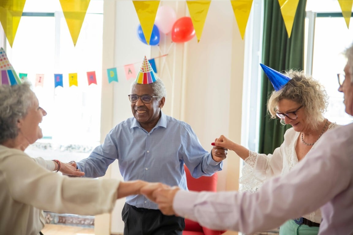 Seniors dancing and celebrating together at a community event